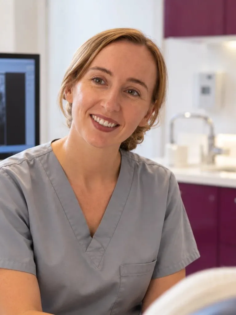 Dentist smiling during a consultation