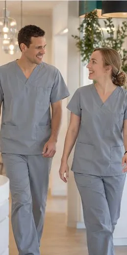 Dr Joao Souteiro and Dr Melanie Bennett walking and talking in the practice