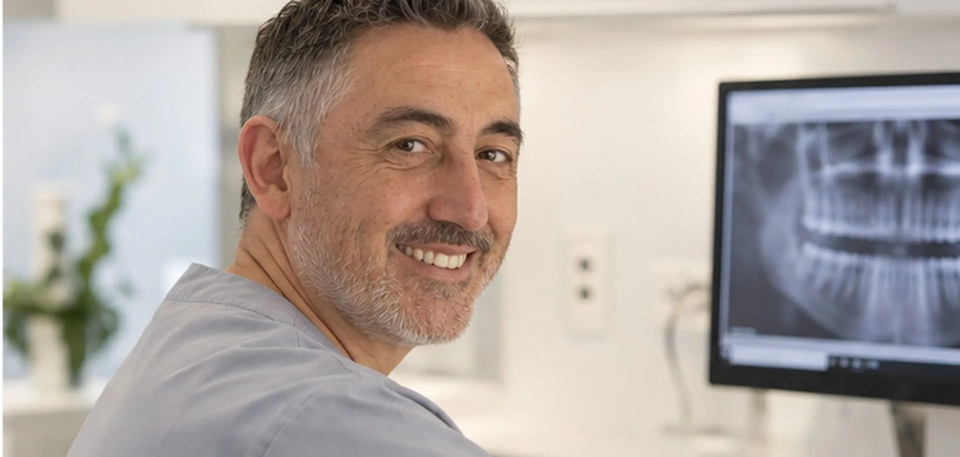 Dr Adrian Jones at his workstation, with an X-ray on the screen