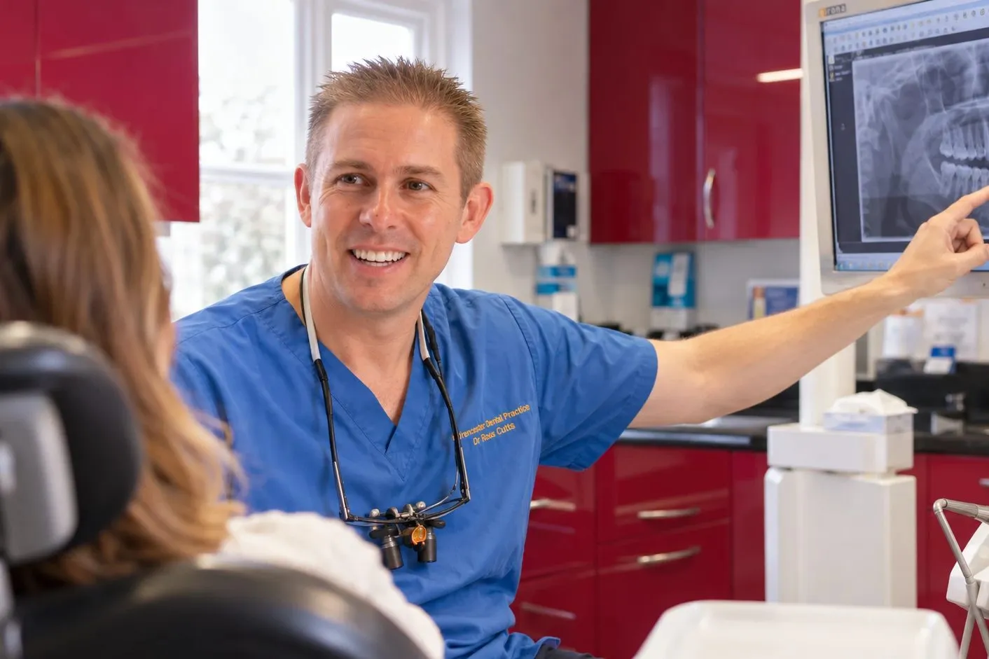 Dr Ross Cutts explaining an X-ray to a patient