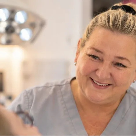 Dr Emma Hopkins smiling with a patient
